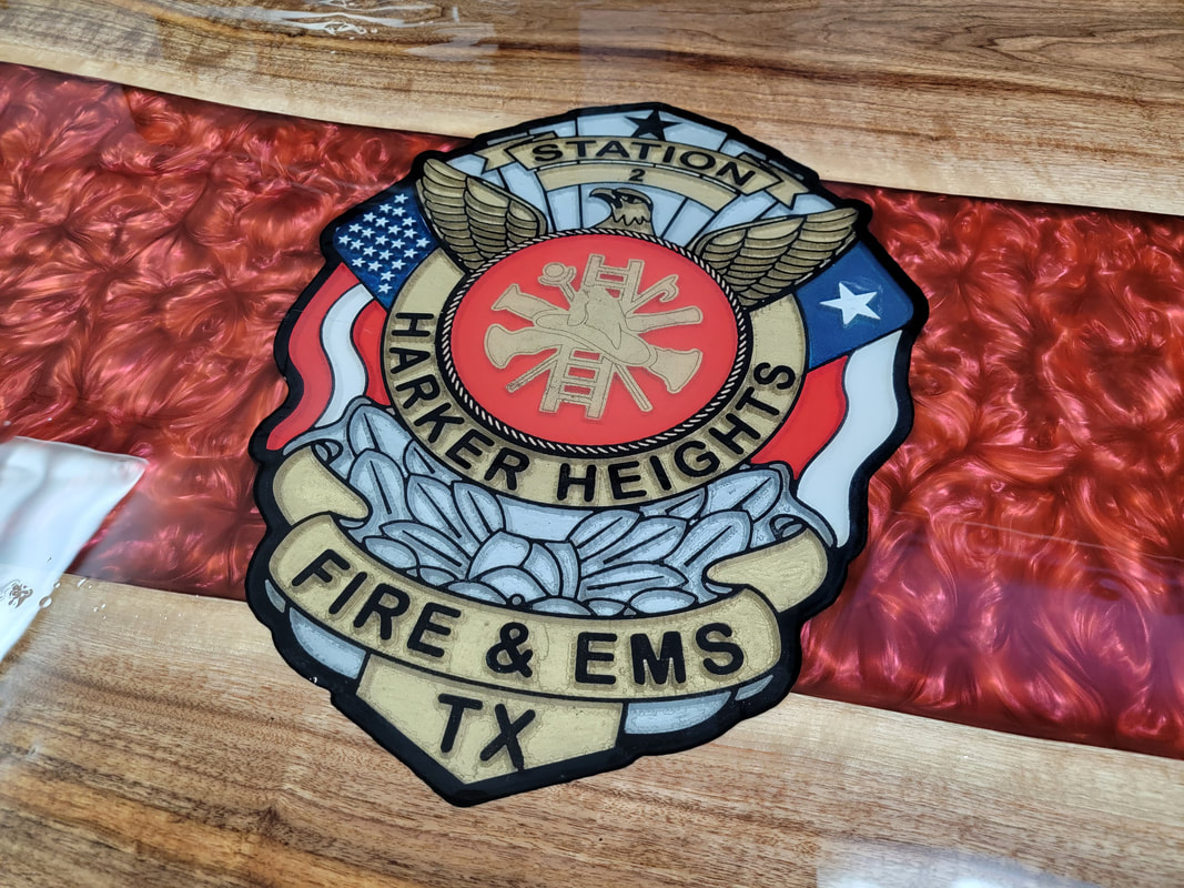 Picture of Harker Heights FD badge inside an epoxy table